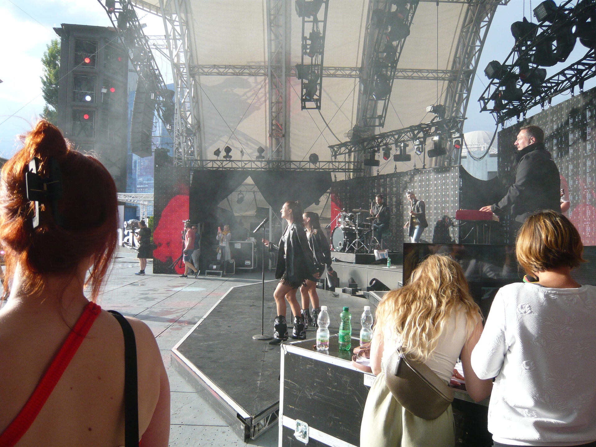 Open-air stage rehearsal seen from the wings