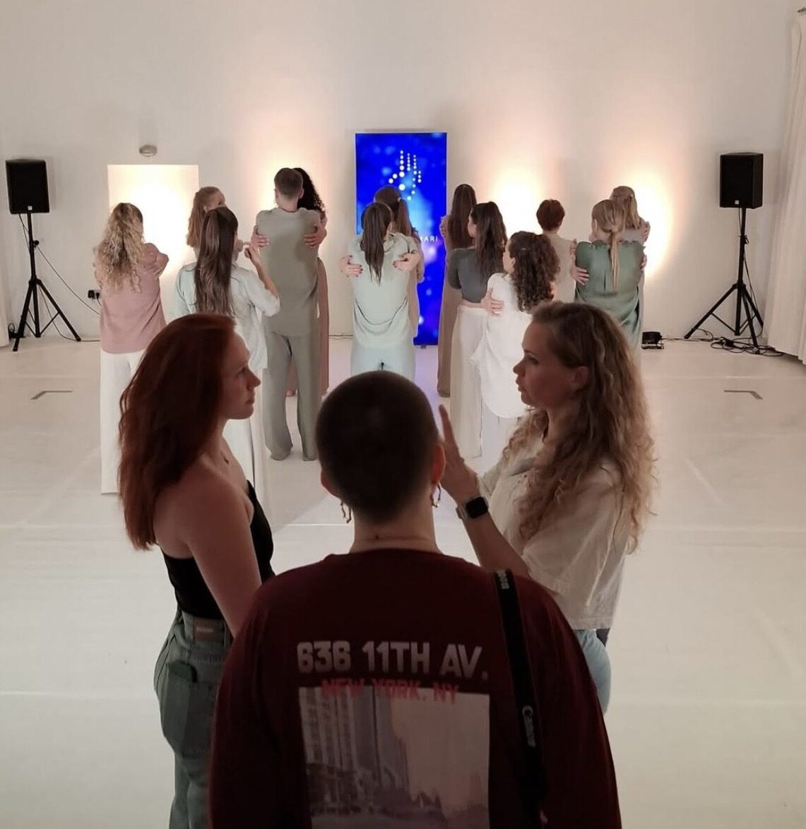 Group rehearsal in a white studio