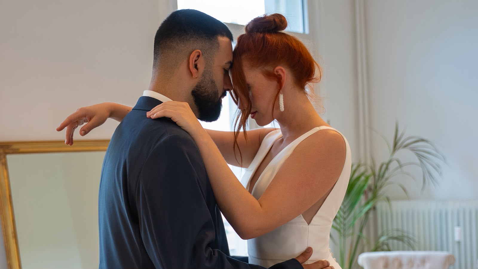 A wedding couple embracing during their first dance